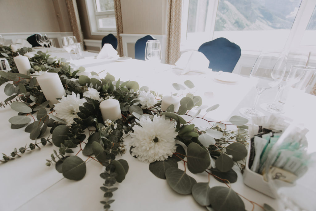 Wedding table setting with wedding flowers by Alpine Blooms