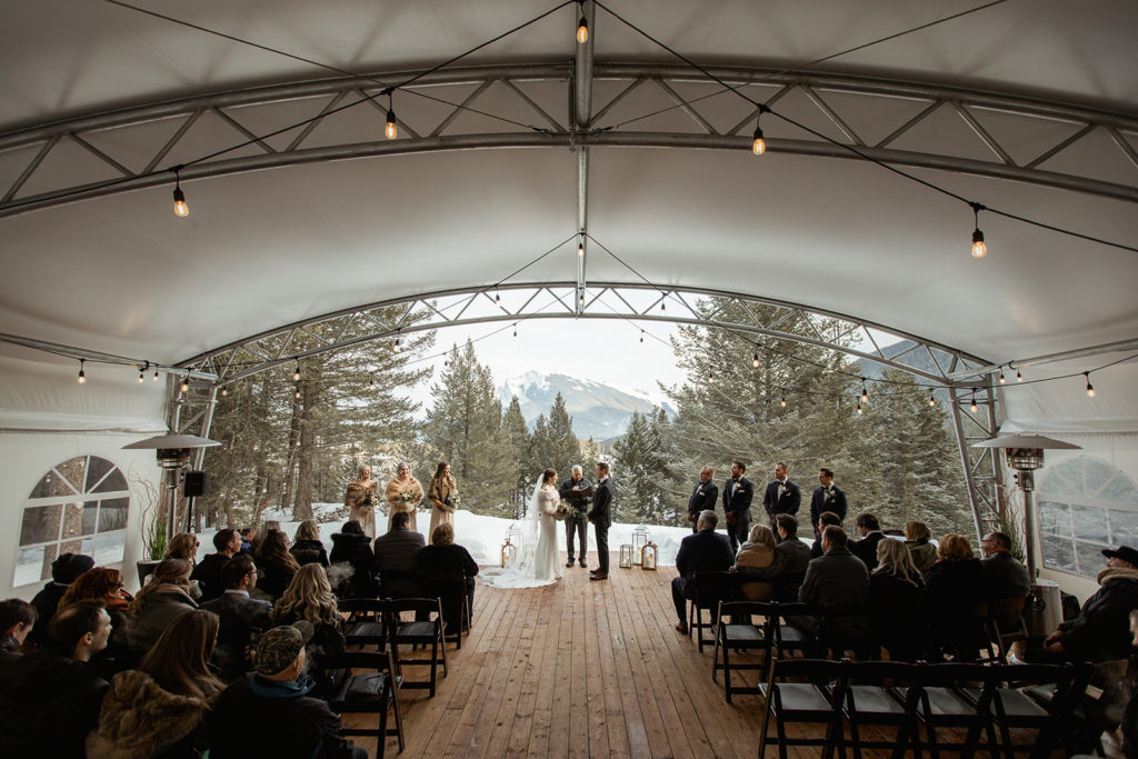 Covered tent outdoor wedding at Canmore Wedding Venue Stewart Creek Golf Course